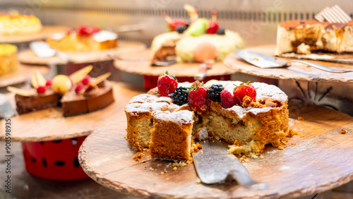 Wallpaper Mural Bright sponge cake with berries. Several pieces have already been eaten Torontodigital.ca