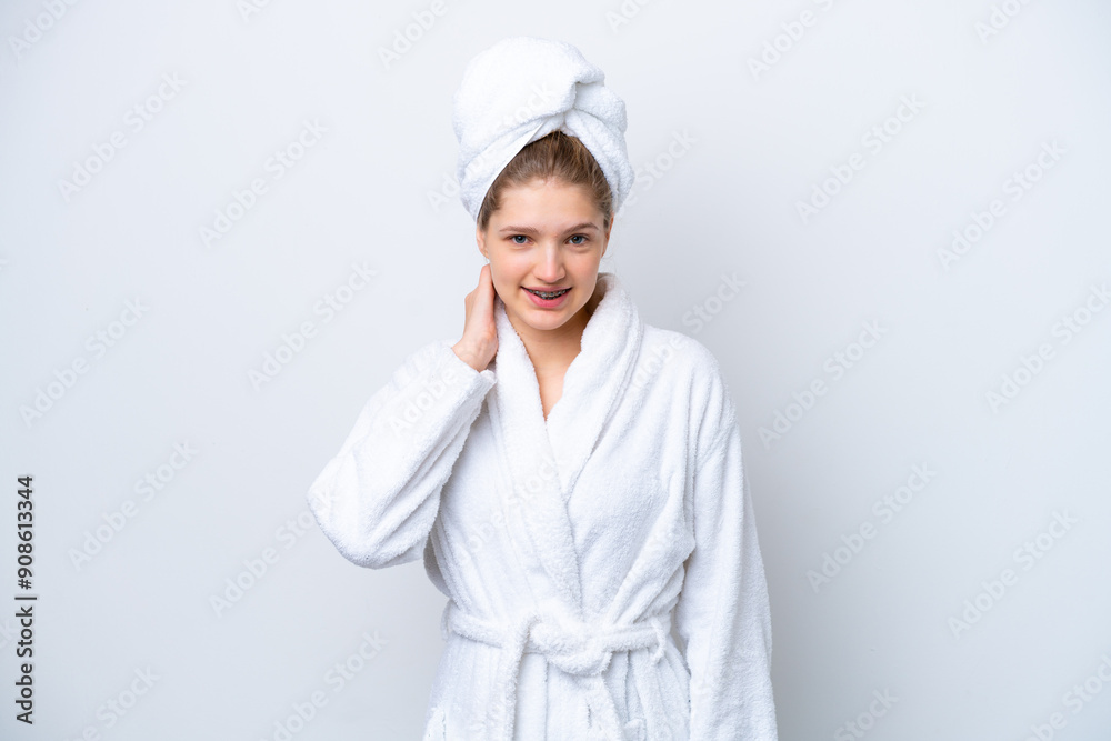 Teenager Russian girl in a bathrobe isolated on white background laughing Teenager Russian girl in a bathrobe isolated on white background laughing