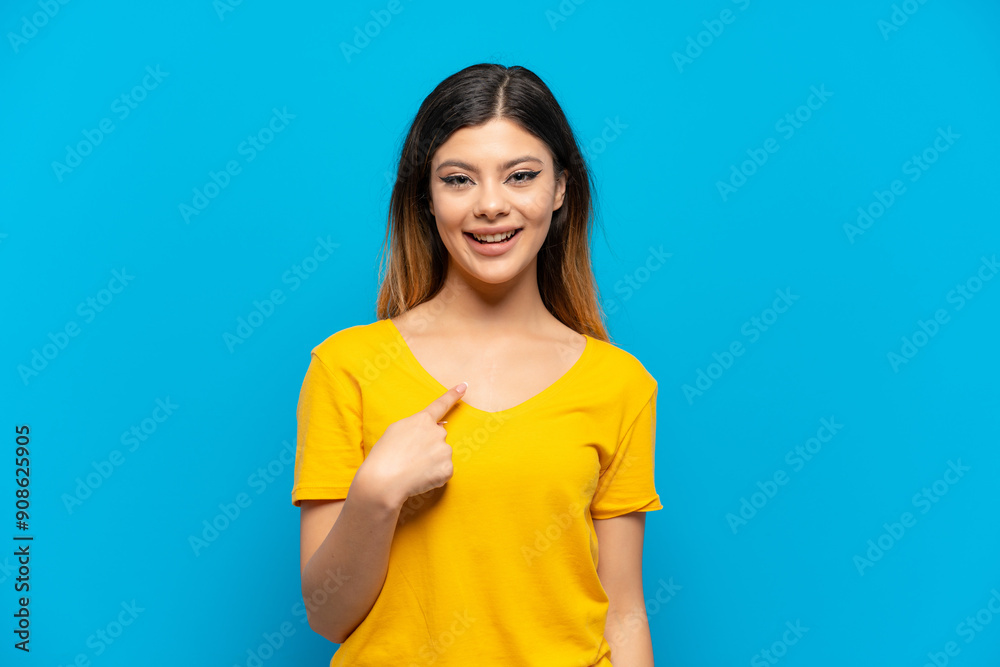 Young Russian girl isolated on blue background with surprise facial expression Young Russian girl isolated on blue background with surprise facial expression
