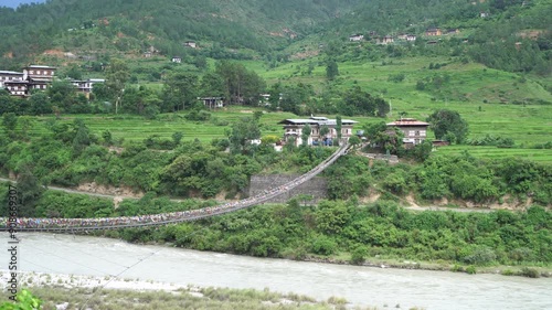 View Punakha Suspension Bridge at Punakha Dzong. Across  between Tsang Chu River to ShengAna and Wangkha village. Longest suspension bridge in Bhutan decorated colorful prayer flags for good life