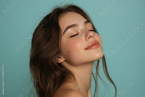 A close up of a girl's face with her eyes closed