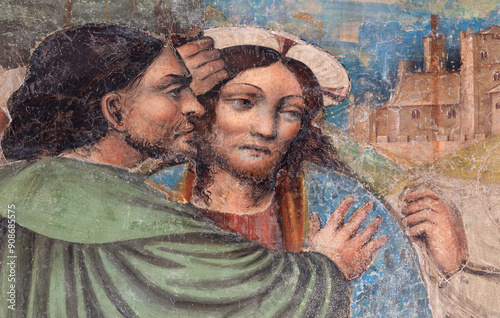 MILAN, ITALY - MARCH 6, 2024: The detail of old fresco of Betray of Jesus with the Judas kiss in the church Basilica di San Lorenzo by unknown local artist from 15. cent. photo