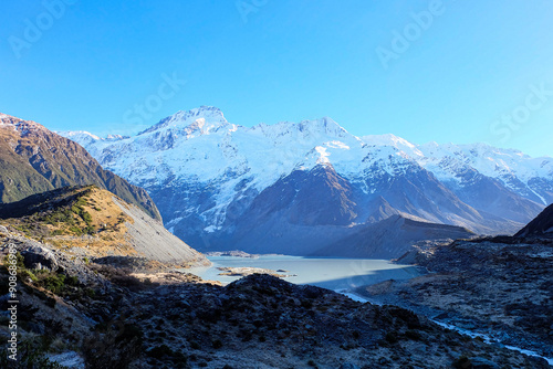 Hiking in a beautiful sunny blue sky winter day at Mount Cook national park, Otago, Canterbury, South Island New Zealand