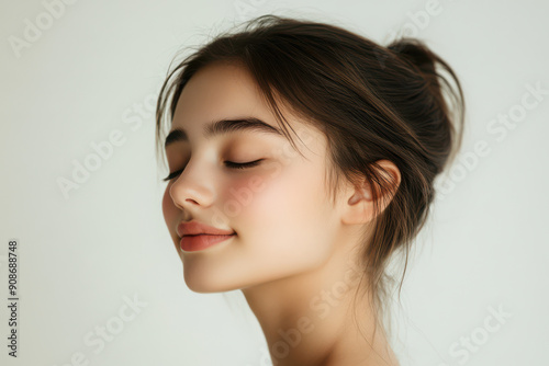 A close up of a girl's face with her eyes closed