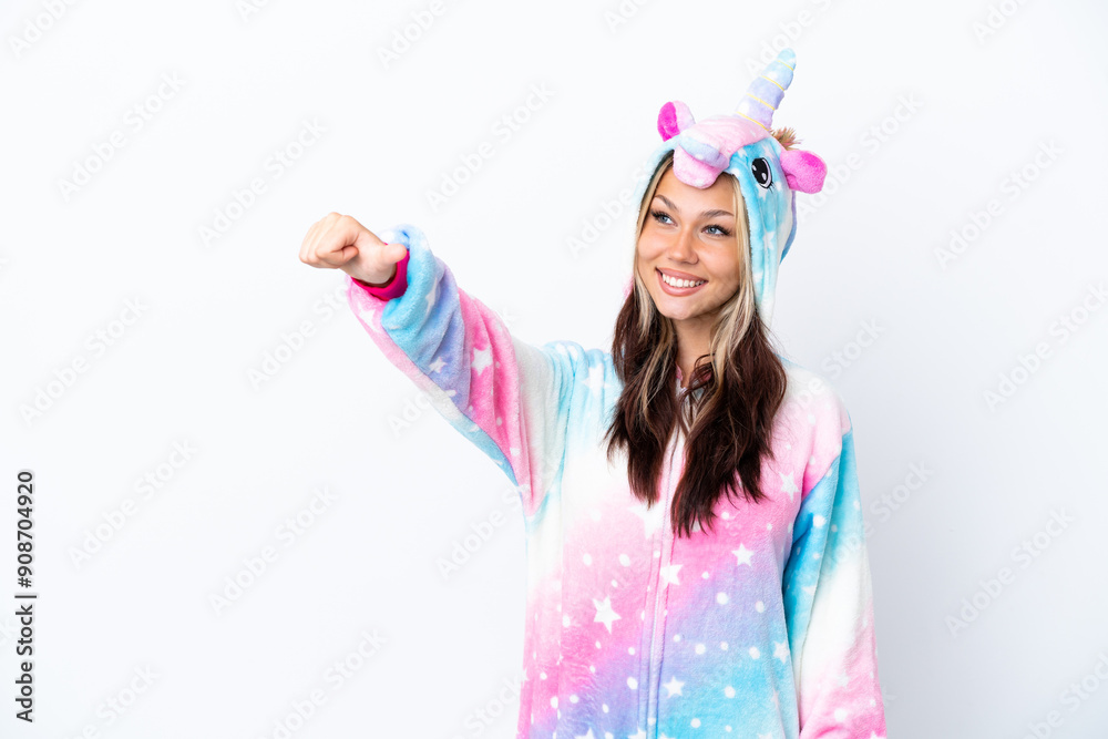 Young Russian woman wearing a unicorn pajama isolated on white background giving a thumbs up gesture Young Russian woman wearing a unicorn pajama isolated on white background giving a thumbs up gesture