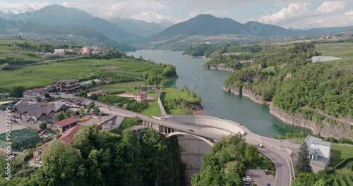 Aerial view lake of santa giustina Italy. A beautiful lake in the Dolomite Alps with apple and fruit orchards on the shore. High quality 4k footage