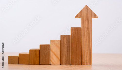 Wooden rising bar graph with an upward arrow on white background. Growth or progress.