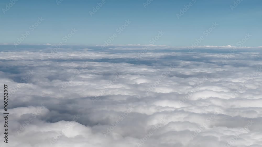 Aerial view from airplane window above cloud.
Aerial view from airplane window above cloud.