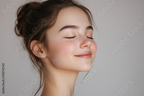 A close up of a girl's face with her eyes closed