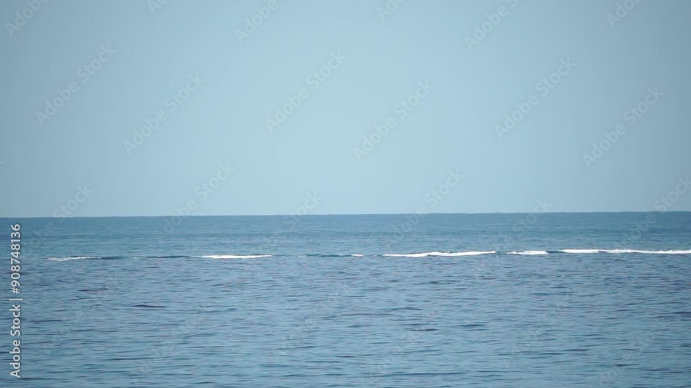 Calm Ocean Surface Under a Clear Blue Sky Calm Ocean Surface Under a Clear Blue Sky