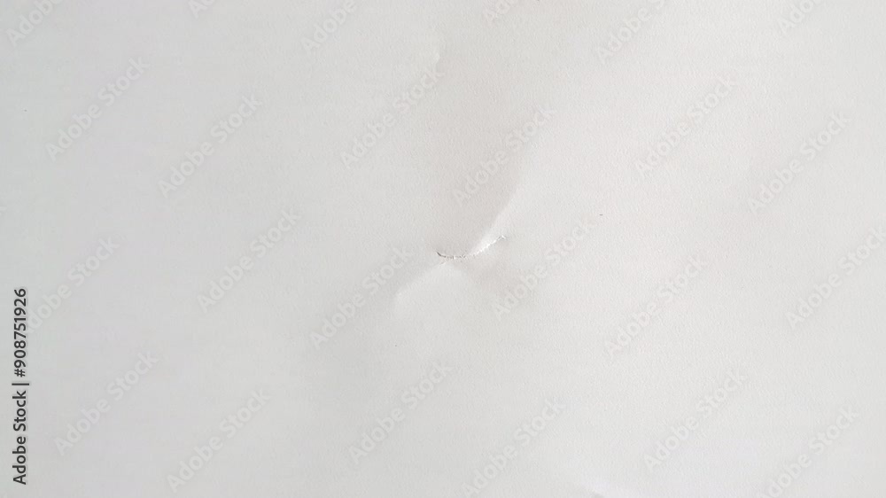 A full screen paper burst with a hole tearing from the middle in a stop motion style.
