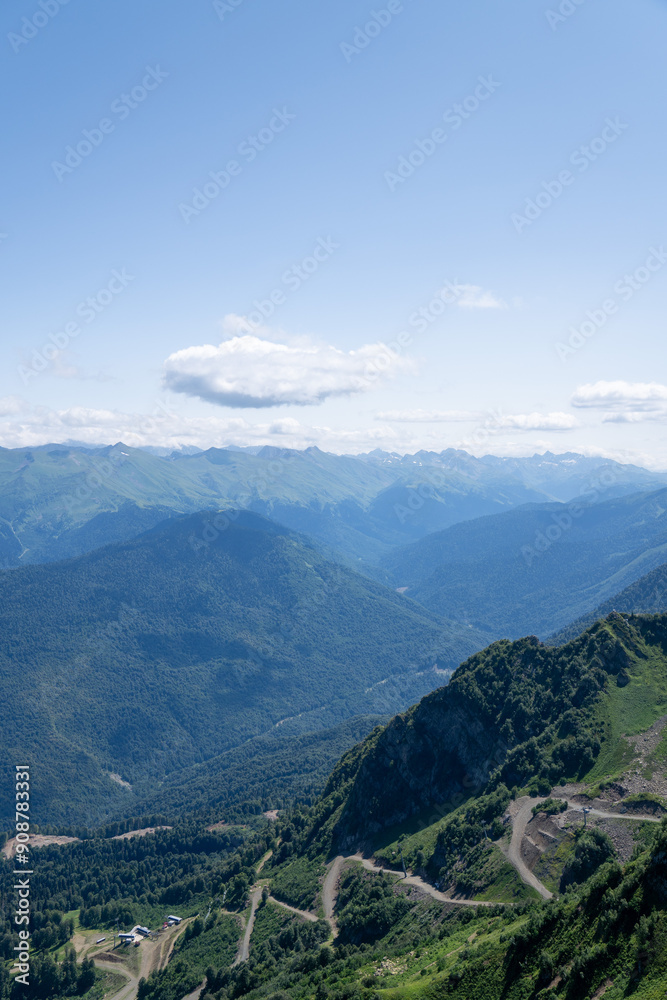 View of rocky mountains and forest on a sunny summer day View of rocky mountains and forest on a sunny summer day