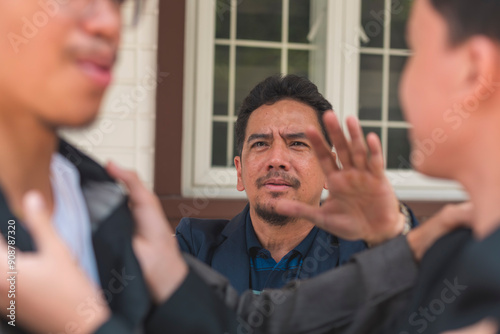 Schilderij op canvas A father tries to break up a fight between his two sons, telling them to stop