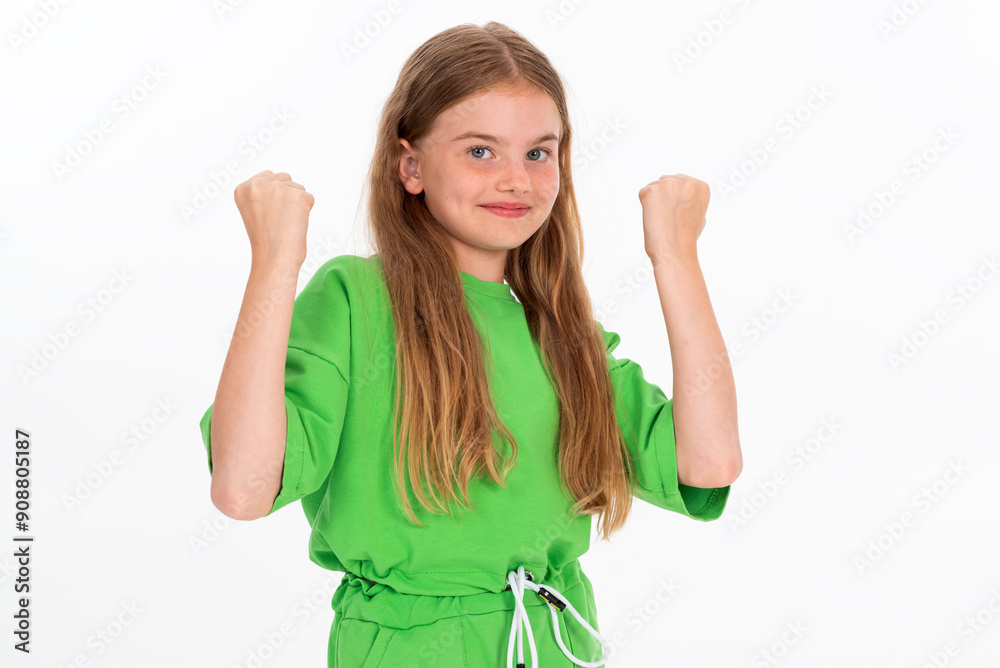 Charming young girl winner isolated on white background in green outfit Charming young girl winner isolated on white background in green outfit