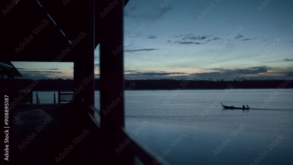 view from panyee island thailand at dusk early morning sunrise a fishing boat crossing the river view from panyee island thailand at dusk early morning sunrise a fishing boat crossing the river