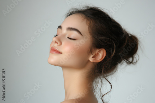 A close up of a girl's face with her eyes closed