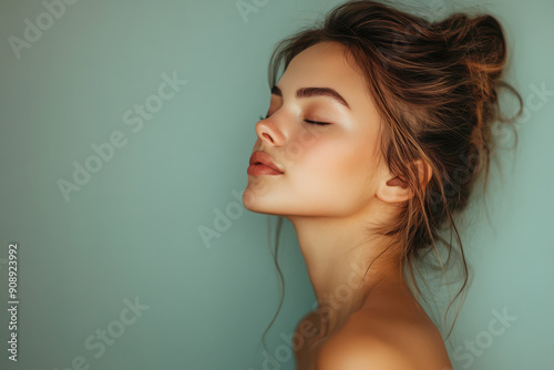 A close up of a girl's face with her eyes closed