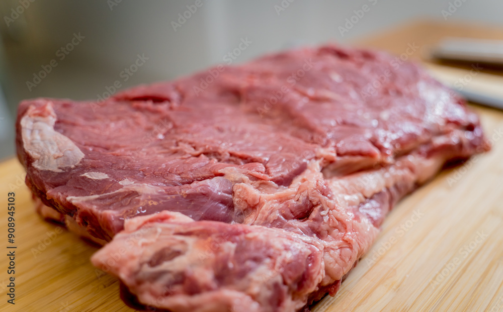 Raw fillet beef meat for steaks on the cutting board Raw fillet beef meat for steaks on the cutting board