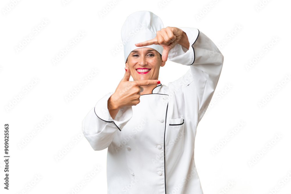 Middle-aged chef woman over isolated background focusing face. Framing symbol Middle-aged chef woman over isolated background focusing face. Framing symbol