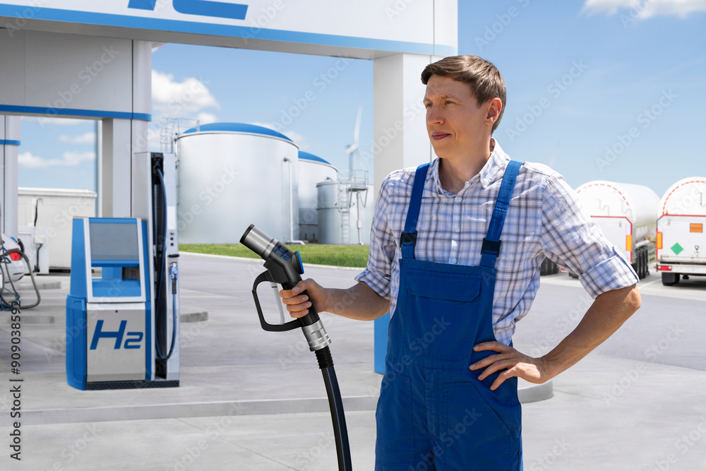 Man holds a hydrogen fueling nozzle. Refueling car with hydrogen fuel. Concept. Man holds a hydrogen fueling nozzle. Refueling car with hydrogen fuel. Concept.