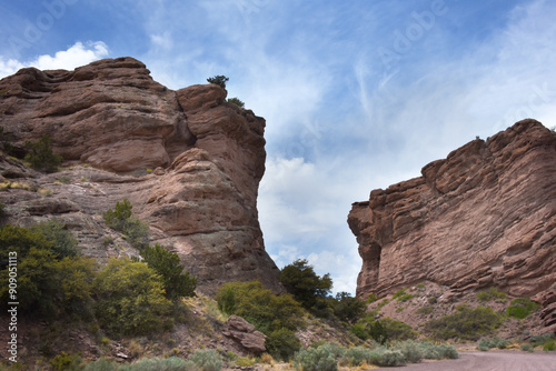 Dirt Road Curves Around Sandstone Cliffs