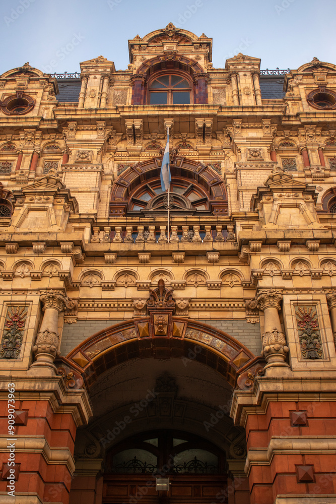 Obraz premium European architecture in Argentina. Palace with design of the second French empire. Argentine Flag 