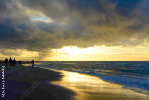 NNetherlands, Kijkduin Beach. Scenery at dutch North Sea with clouds before sunset with reflections in the water photo