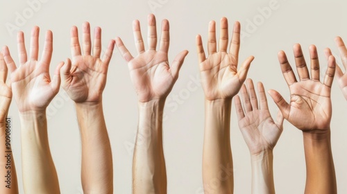 A group of hands raised together symbolizing support and solidarity