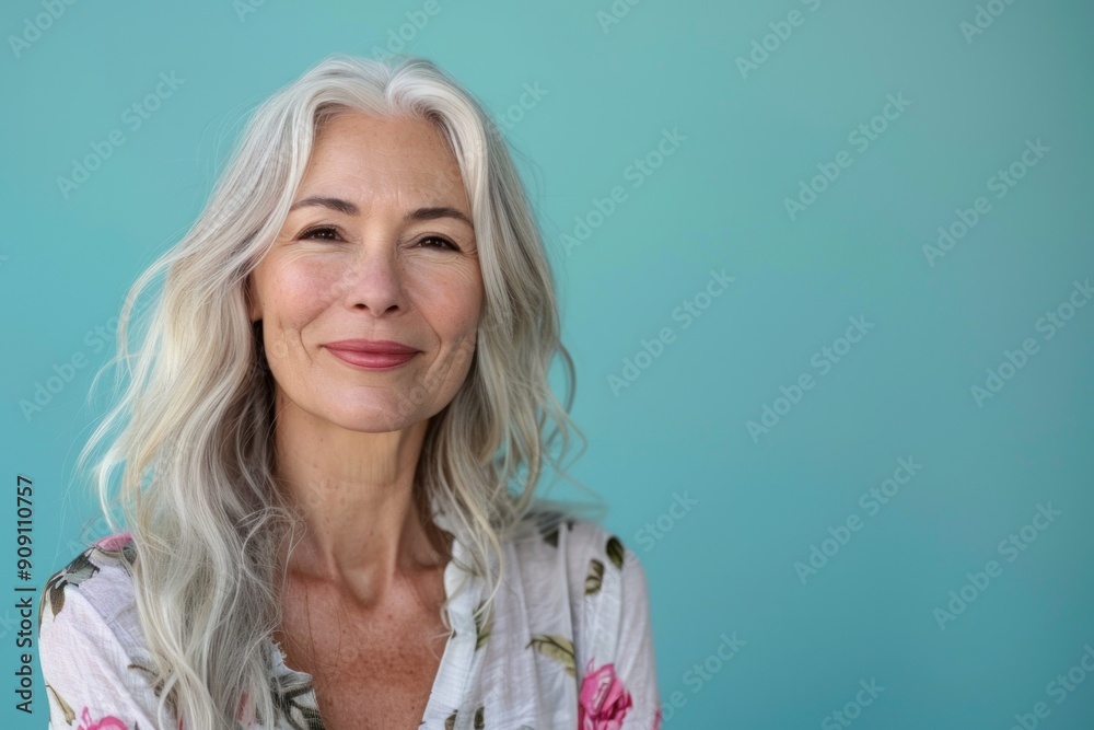 Fototapeta premium Portrait of Happy Smiling attractive mature woman on colored background with copy space, banner template