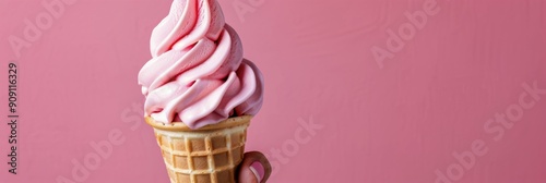 Delicious Swirled Strawberry Soft Serve Ice Cream Cone Against a Blurred Back...