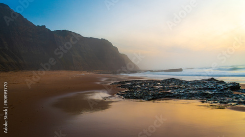 Sunset over the ocean. Summer holidays in Portugal. Beach at sunset