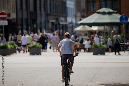 Man riding a bike in the city streets of Riga, Latvia