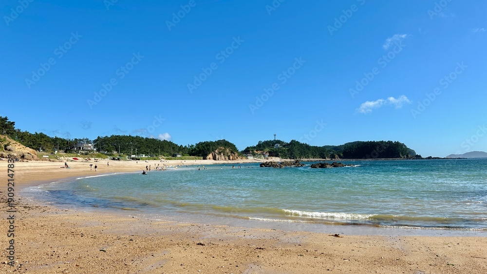 Beach on a small bay with tropical ocean Beach on a small bay with tropical ocean