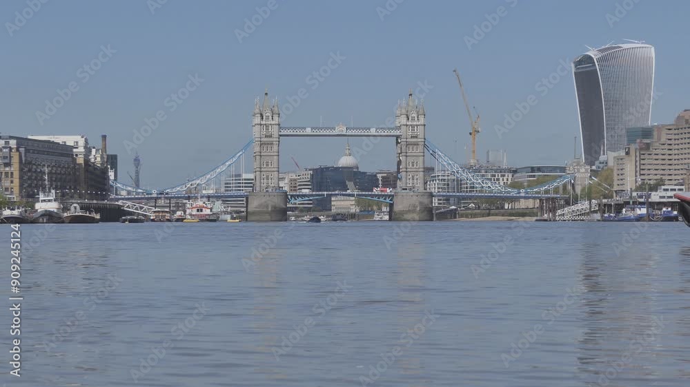 A view of the Tower bridge and River Thames with an approaching boat. A view of the Tower bridge and River Thames with an approaching boat.