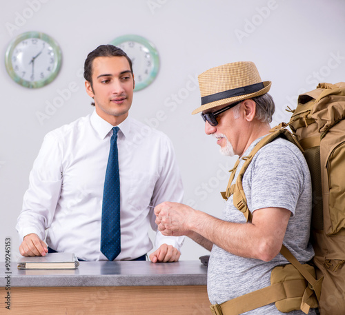 Backpacker at the hotel reception