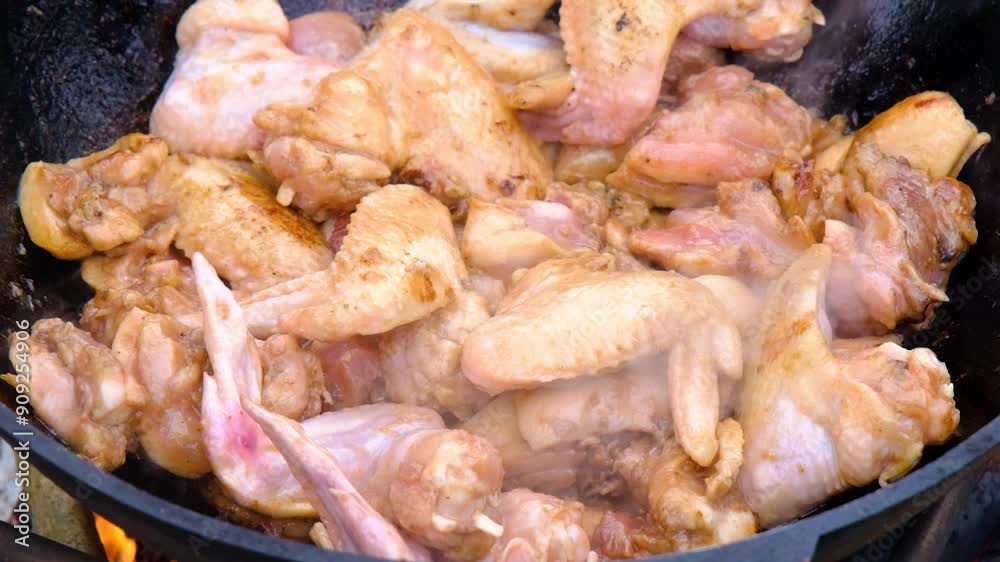 The meat is stewed in a cauldron. Chicken meat is stewed in a cauldron. A dish on a fire in a cauldron. Stewing meat in a cauldron The meat is stewed in a cauldron. Chicken meat is stewed in a cauldron. A dish on a fire in a cauldron. Stewing meat in a cauldron