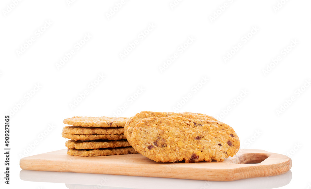 Several sweet fruit cookies on a wooden kitchen board, macro, isolated on white background. Several sweet fruit cookies on a wooden kitchen board, macro, isolated on white background.