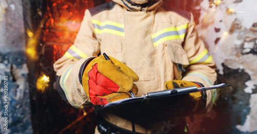 Obraz na plátne Fireman inspector uses clipboard and conducts investigation to determine circumstances of fire in house