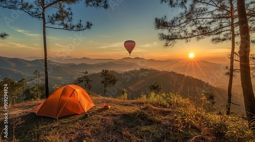 Orange tent in camping area in top of Mea Omgi at Tak, North of Thailand in winter season and balloon, Laandscape view point photo