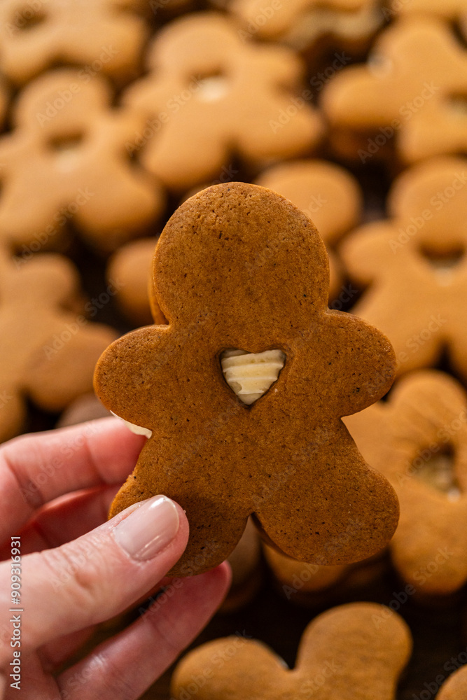 Making Festive Gingerbread Sandwiches on Rustic Wooden Table Making Festive Gingerbread Sandwiches on Rustic Wooden Table