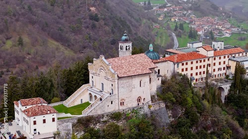 Cinematic aerial footage of Sanctuary Montecastello church on top mountain near Lake Garda in Italy photo