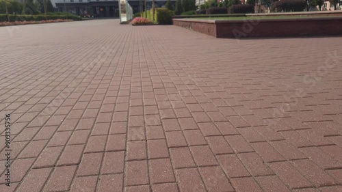 Young Rider Performs Tricks on Scooter at Local Park During Sunny Afternoon