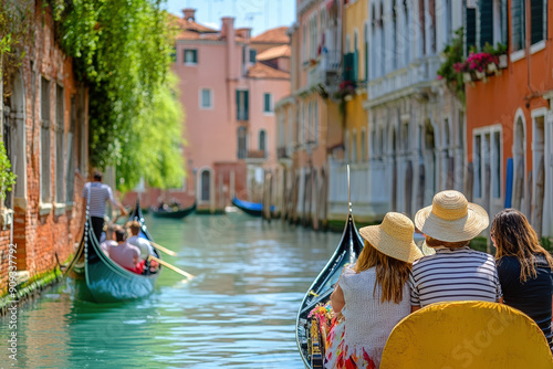 Friends enjoying gondola ride in Venice. photo