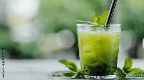 Refreshing Green Smoothie on Vibrant Green Leaves With Raindrops