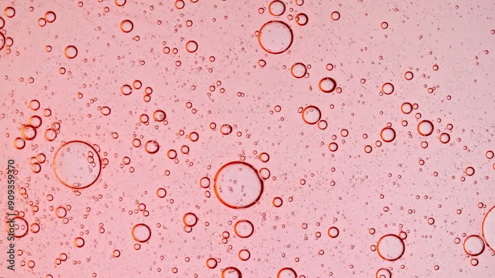 Transparent Pink Cosmetic Gel Fluid With Molecule Bubbles Distribution. Bubble Cluster Motion, Cells Under a Microscope. Macro Shot of Natural Organic Cosmetics, Medicine. Close-up. Slow Motion. 4k Transparent Pink Cosmetic Gel Fluid With Molecule Bubbles Distribution. Bubble Cluster Motion, Cells Under a Microscope. Macro Shot of Natural Organic Cosmetics, Medicine. Close-up. Slow Motion. 4k