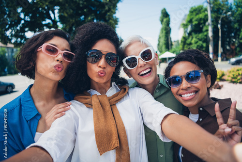 Photo of company friends women take selfie v-sign kiss free time chill walk city park outdoors