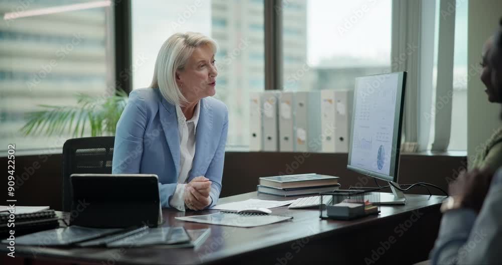 Mature woman, tech and proposal in office with staff, papers or meeting for job opportunity. Female HR officer, computer or people in city for onboarding, recruitment or contract discussion with team Mature woman, tech and proposal in office with staff, papers or meeting for job opportunity. Female HR officer, computer or people in city for onboarding, recruitment or contract discussion with team