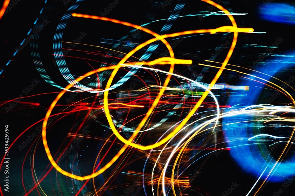 A blurry image of colorful lines and shapes. The colors are bright and the lines are wavy, giving the impression of movement and energy. Scene is dynamic and lively A blurry image of colorful lines and shapes. The colors are bright and the lines are wavy, giving the impression of movement and energy. Scene is dynamic and lively