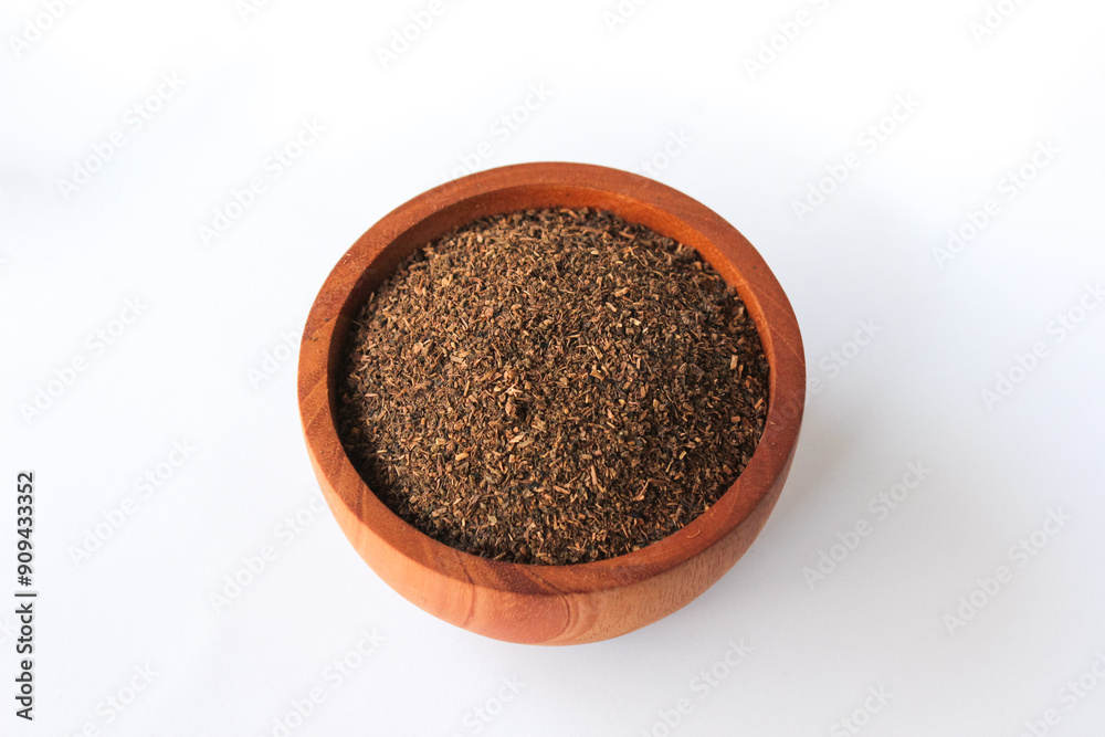 Tea Powder - Tea leaf after blended and dried in a wooden bowl isolated on white background Tea Powder - Tea leaf after blended and dried in a wooden bowl isolated on white background