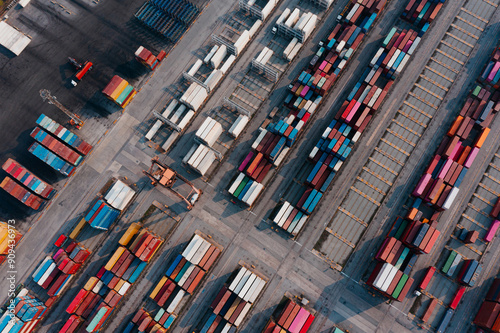 Aerial top view of Container ship loading and unloading at cargo shipping port, Cargo container in deep seaport for the international order concept. photo